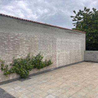 Forhoejelse af mur til drivhus